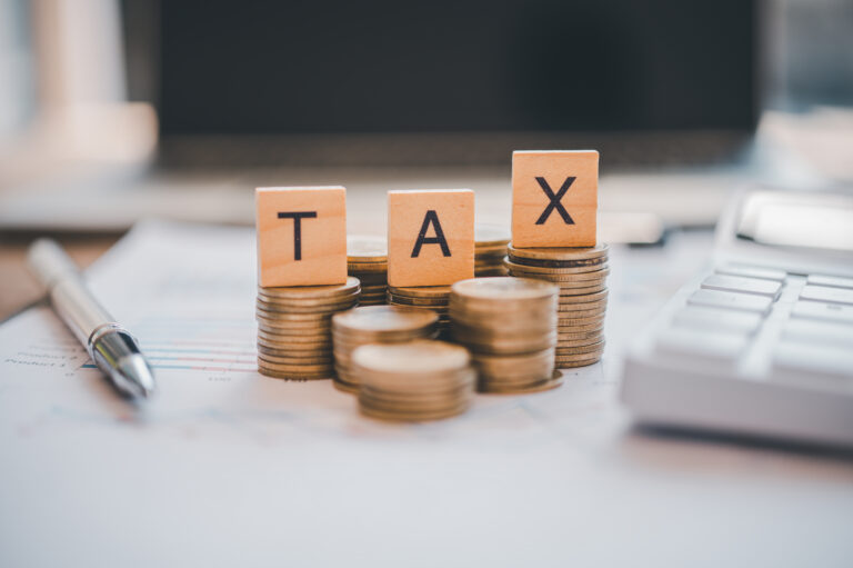 Payment and tax calculation Concept Wooden blocks word " TAX" on