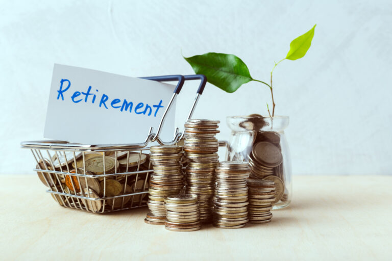 Saving coins for retirement with a small plant and a basket on a