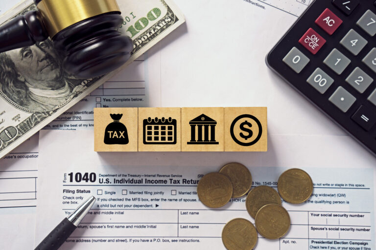 Tax concept.Tax icon on wooden block